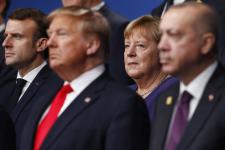Donald Trump and Angela Merkel in the background