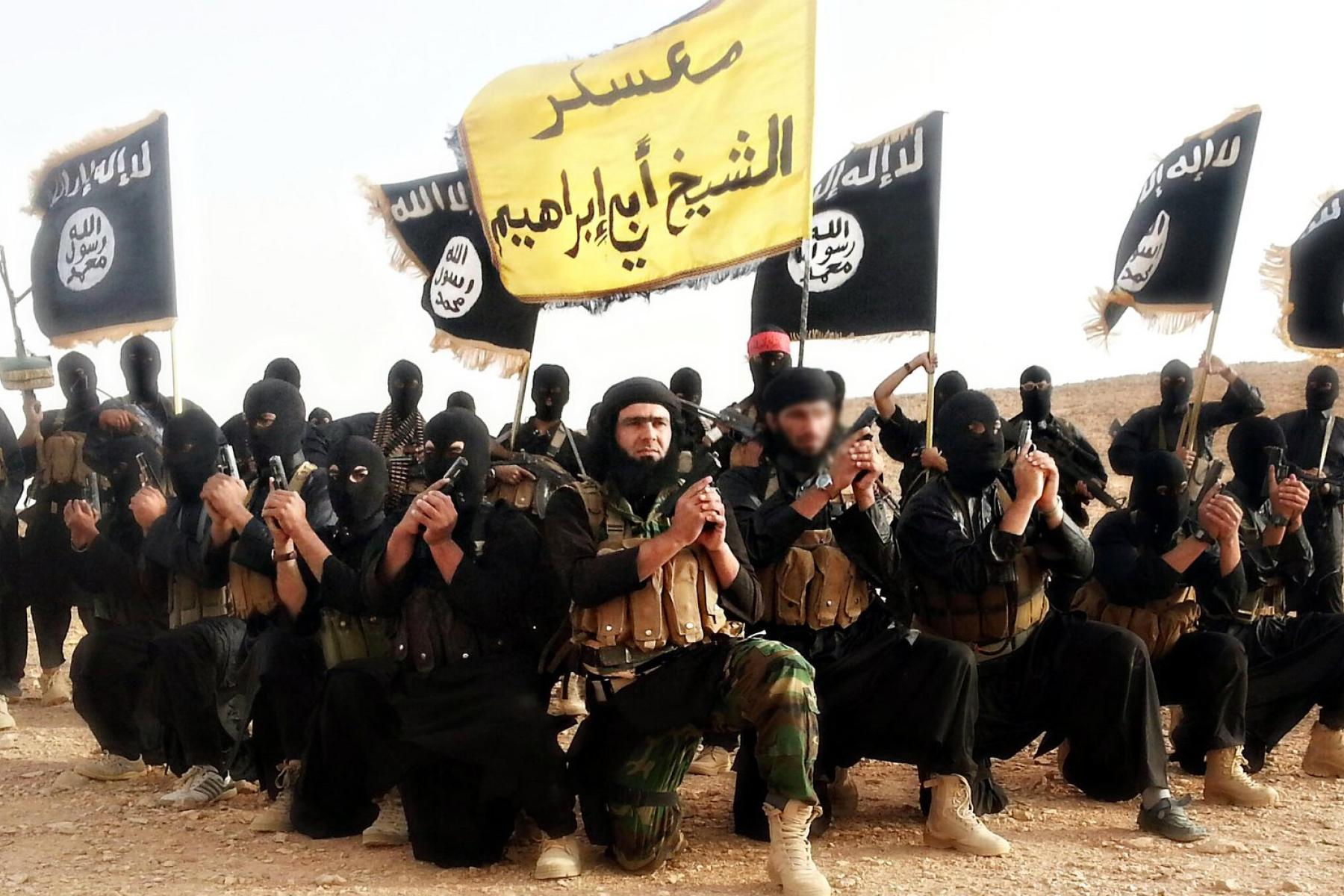 Islamic State of Iraq and the Levant fighters pose in a propaganda photo released by the organization