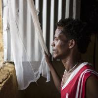 Eritrean refugee Shewit Hadera looks out of the window in the Adi-Harush Camp in northern Ethiopia. 