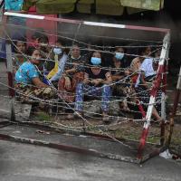 Myanmar people waiting outside prison