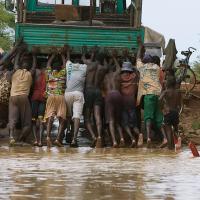 Men pushing truck, Burkina Faso
